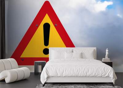 Hazard ahead warning road sign against cloudy sky in Iceland Wall mural