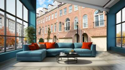 Row of newly built brick town houses in a housing development on a sunny autumn morning Wall mural