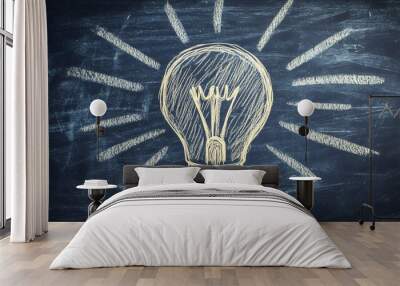 A light bulb drawn on a chalkboard, rays of light shining outward, representing the spark of a new idea, minimalistic flat design with soft chalk texture Wall mural