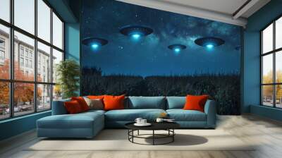 Fleet of UFOs flying over a vast cornfield at night, bright lights illuminating the crops and creating mysterious patterns Wall mural