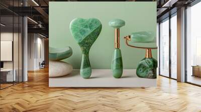 Set of beauty facial massage tools, featuring Green Aventurine and Rose Quartz Gua Sha mushrooms, jade roller, and stone, isolated background, studio lighting Wall mural