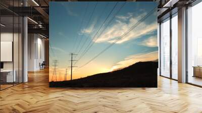 power transmission towers at sunset Wall mural