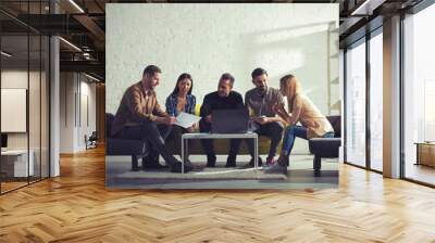 Business people connected on internet network with a laptop in a relax room. concept of startup company Wall mural