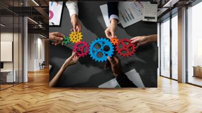 Business team connect pieces of gears. Teamwork, partnership and integration concept Wall mural