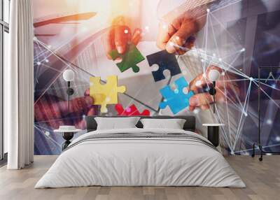 Business team connect pieces of puzzles. Teamwork, partnership and integration concept. double exposure with network effects Wall mural