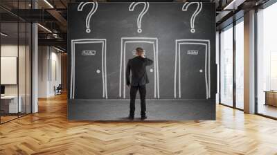 Businessman choosing the right door Wall mural