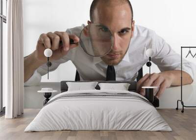 Businessman looks on the computer with a  lens Wall mural