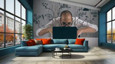 Businessman working with laptop Wall mural