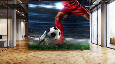 Close up of a football action scene with competing soccer players at the stadium Wall mural