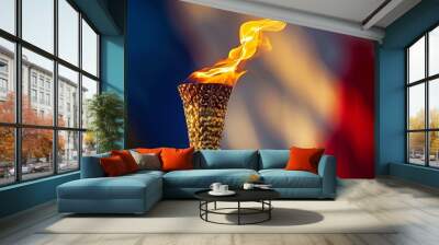 Close-up of the olympic torch lit with a vibrant flame, representing the spirit of the games Wall mural