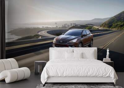 Contemporary brown suv ascends a coastal highway with the city skyline in the background Wall mural