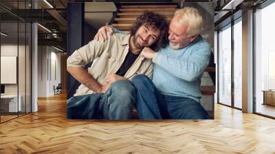 Father and son play together at home. Concept of family relationship Wall mural