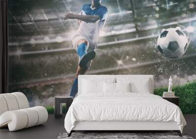 Football scene at night match with player kicking the ball with power Wall mural