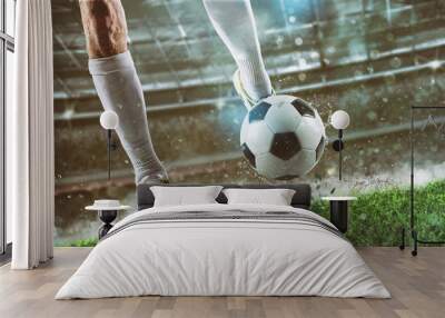 Football scene at night match with player ready to shoot the ball Wall mural