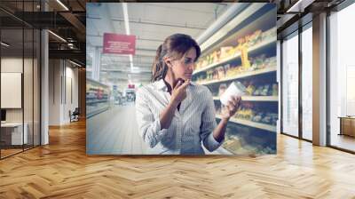 girl unsure at supermarket Wall mural