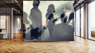 Handshaking business person in office. concept of teamwork and partnership. double exposure Wall mural