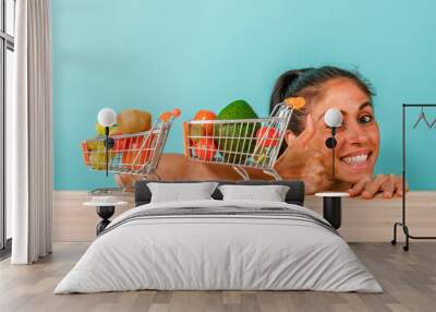 Happy woman made an healthy shopping of fruit Wall mural