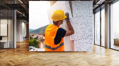 Polystyrene thermal cladding for energy saving on a construction site Wall mural