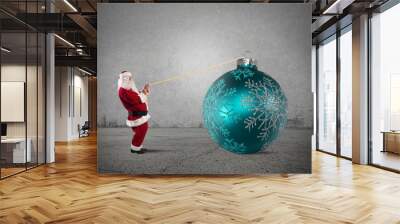 Santa Claus with big Christmas ball Wall mural