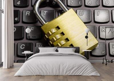 Locked combination padlock on keyboard symbolizing data security Wall mural