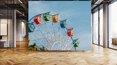 Ferris wheel over blue sky Wall mural