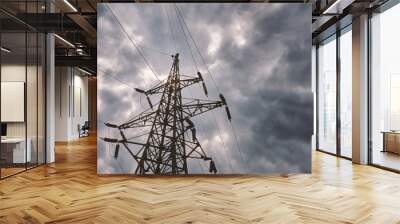 High voltage electrical transmission towers and power lines on field Wall mural