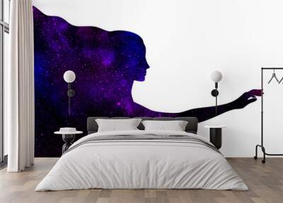 Blue and purple shining star universe in the shape of a woman's profile silhouette with outstretched hand on a black background Wall mural