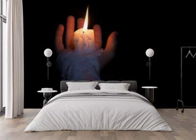 Open hand holding candle stick with wax flowing down the arm Wall mural