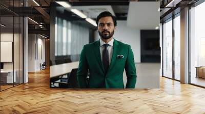 adult black hair european man in green formal attire model portrait looking confident on an office background for ad concept space for text Wall mural