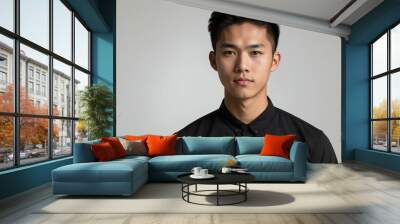 teen stunning brunette asian man with black shirt model portrait standing straight on a plain white background for ad concept space for text Wall mural