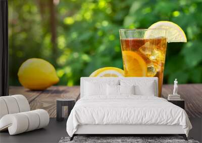 glass of ice tea on wooden table Wall mural