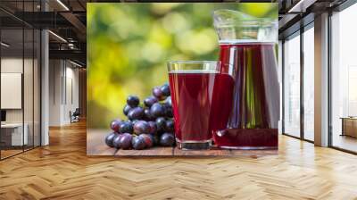 grape juice in glass and jug Wall mural