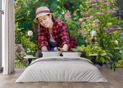 woman gardener planting flowers Wall mural