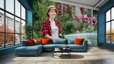 woman gardener watering garden Wall mural