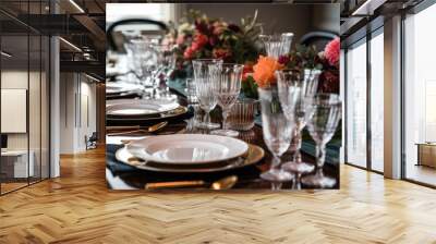 a table setup featuring several plates, glasses, and silverware sets Wall mural