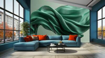 Abstract image of flowing green fabric suspended mid-air against a soft gradient background, showcasing texture and movement Wall mural