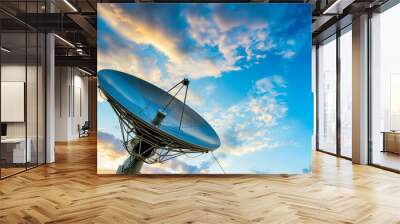 satellite dish against a blue sky with clouds Wall mural