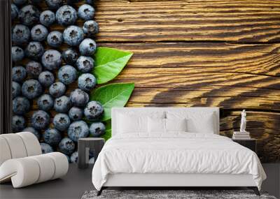 Blueberries on old wooden table Wall mural