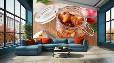 Apple jam in jar on wooden table Wall mural