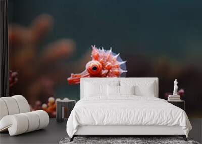 A small red sea creature is swimming in a coral reef Wall mural