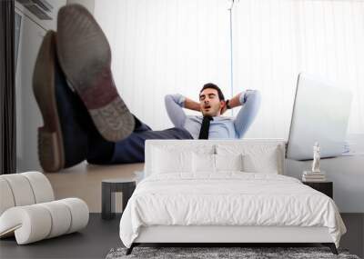 Young lazy businessman sleeps at office Wall mural