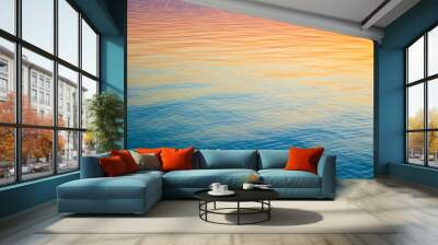 Clear water texture in blue and orange. Background of the ocean and the sea backlit by the sun. Soft waves. Natural water Wall mural