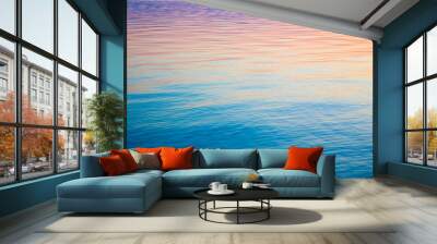 Clear water texture in blue and orange. Background of the ocean and the sea backlit by the sun. Soft waves. Natural water Wall mural