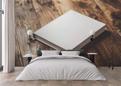 An empty notebook resting on a rustic wooden table under natural light Wall mural