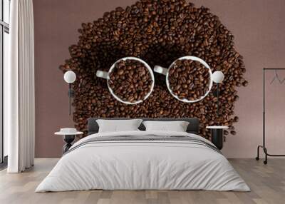 two cups of coffee on a pile of coffee beans on a brown background. Wall mural