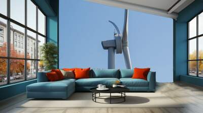 Close-up of wind turbine against blue sky. Concept of green, clean, renewable energy. Wall mural