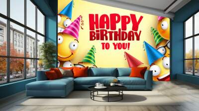 Happy birthday vector smileys greetings design with funny and happy yellow emoticons wearing colorful party hats in yellow background. Smileys vector illustration.
 Wall mural