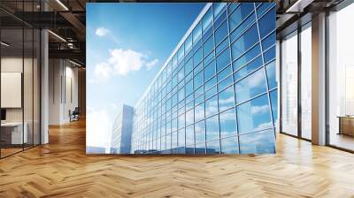 Modern office building against blue sky Wall mural