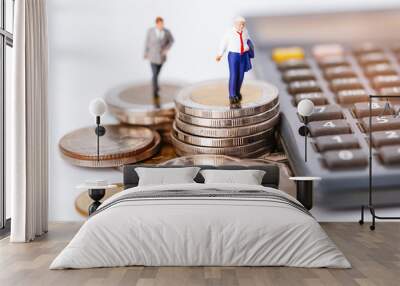 Business man miniature people stand on coin and calculator : management business finance concept. Wall mural