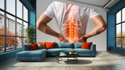 Man pain office syndrome at his back with highlight at backbone and spine. Wall mural